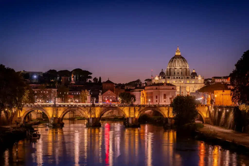View of St. Peters Basilica from the Tiber River, Rome. Photo © Dan Ring / Unsplash
